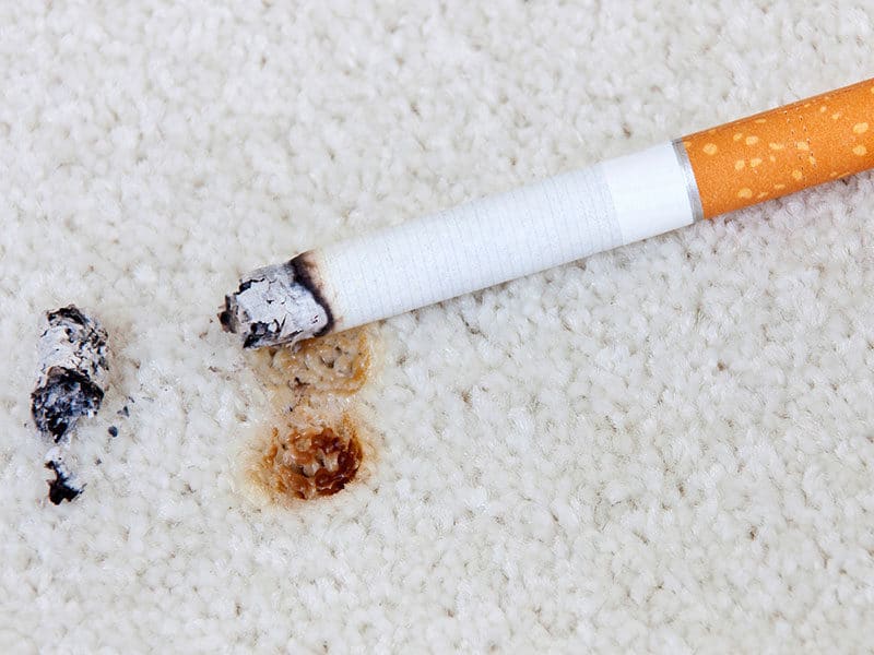 Burning Cigarette on Carpet