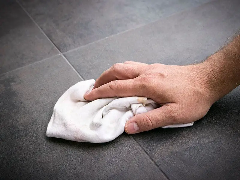 Mans Hand Wipes Clean Rag Across