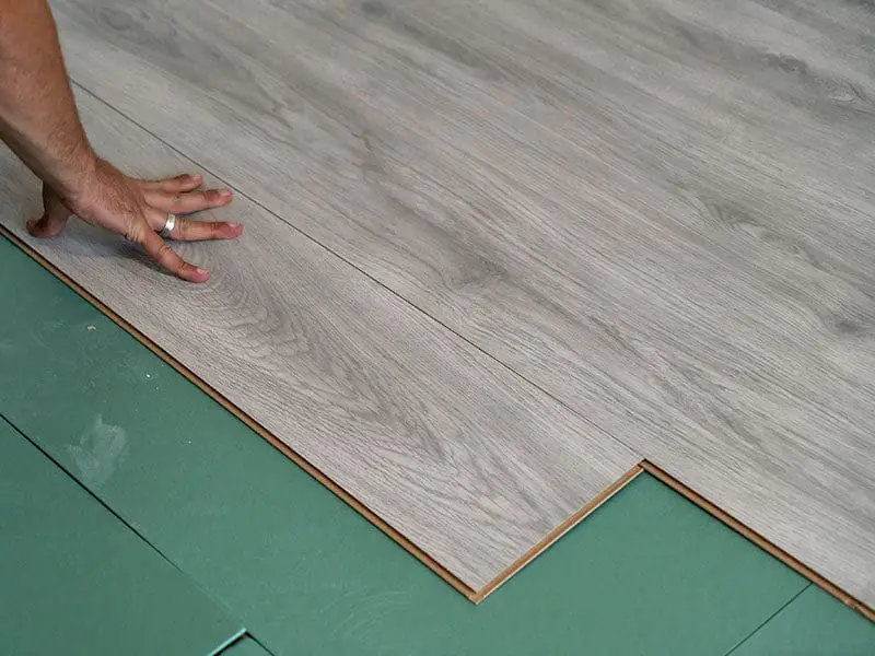 Worker Installing Laminate