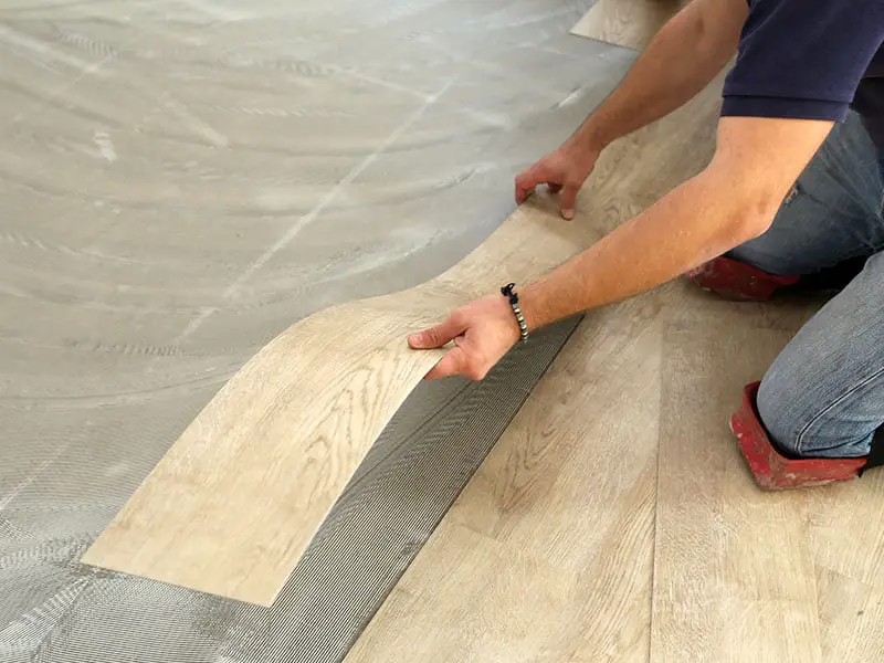 Laying Flooring Worker Installing