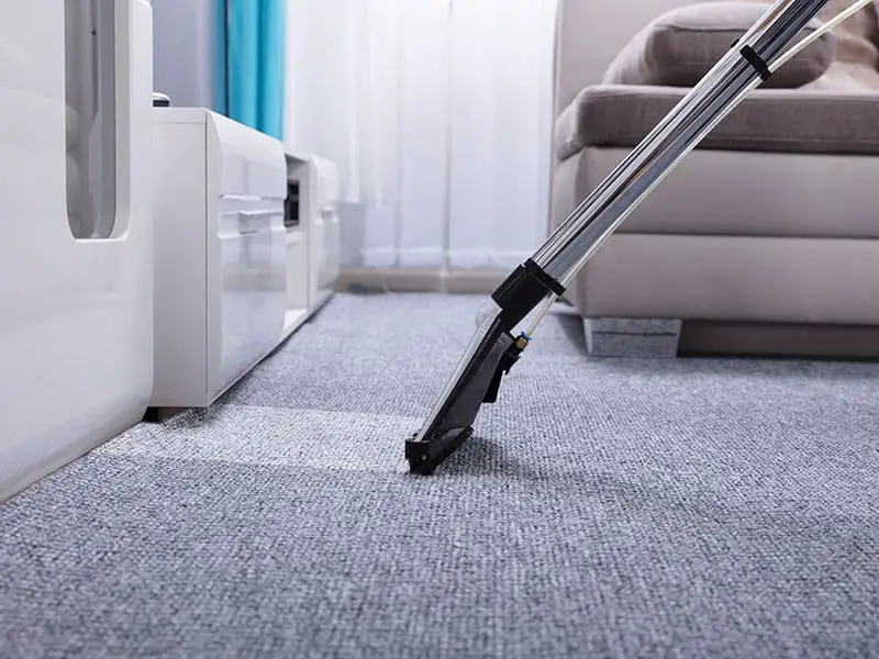 Vacuum Cleaner Over Grey Carpet